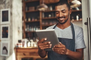 Restaurant Worker Using Restaurant Labor Management Software