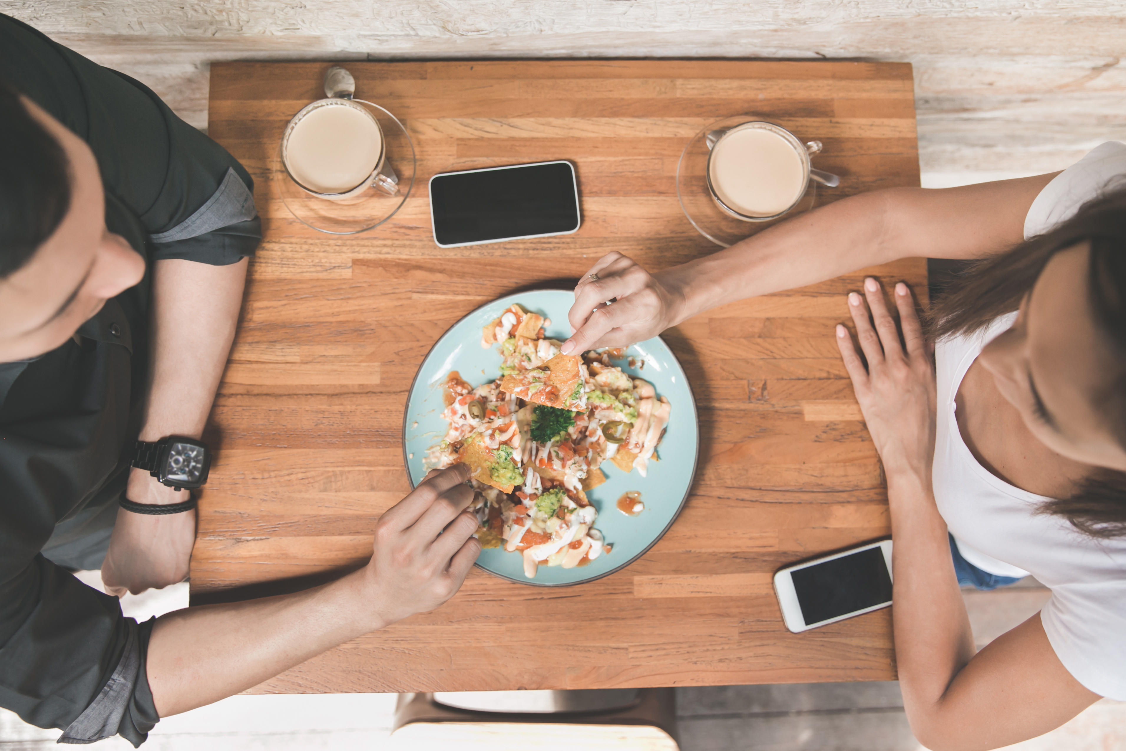 Gen Z Restaurant Customers With Their Phones