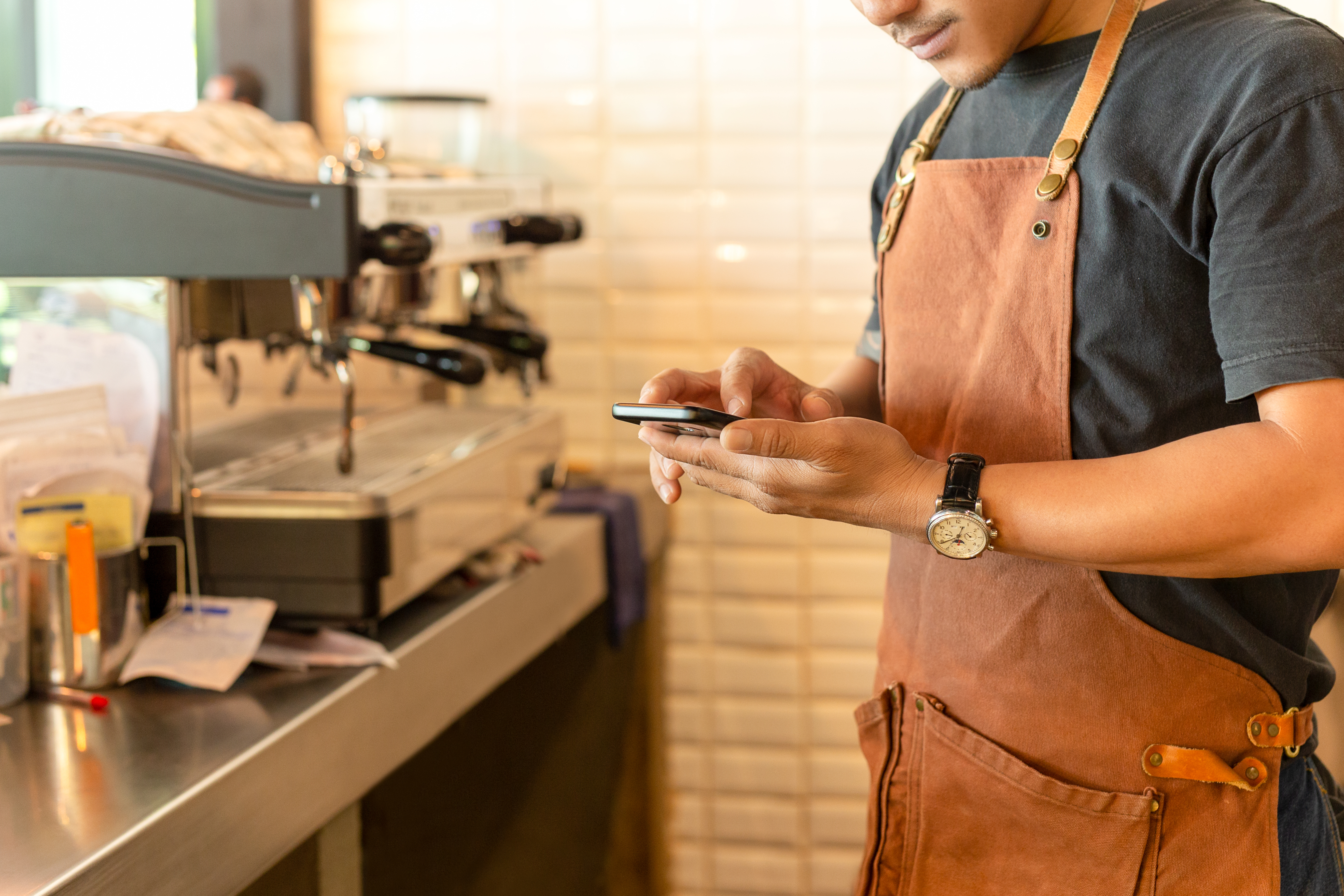 Waiter Using Cloud-Based Restaurant Management Software