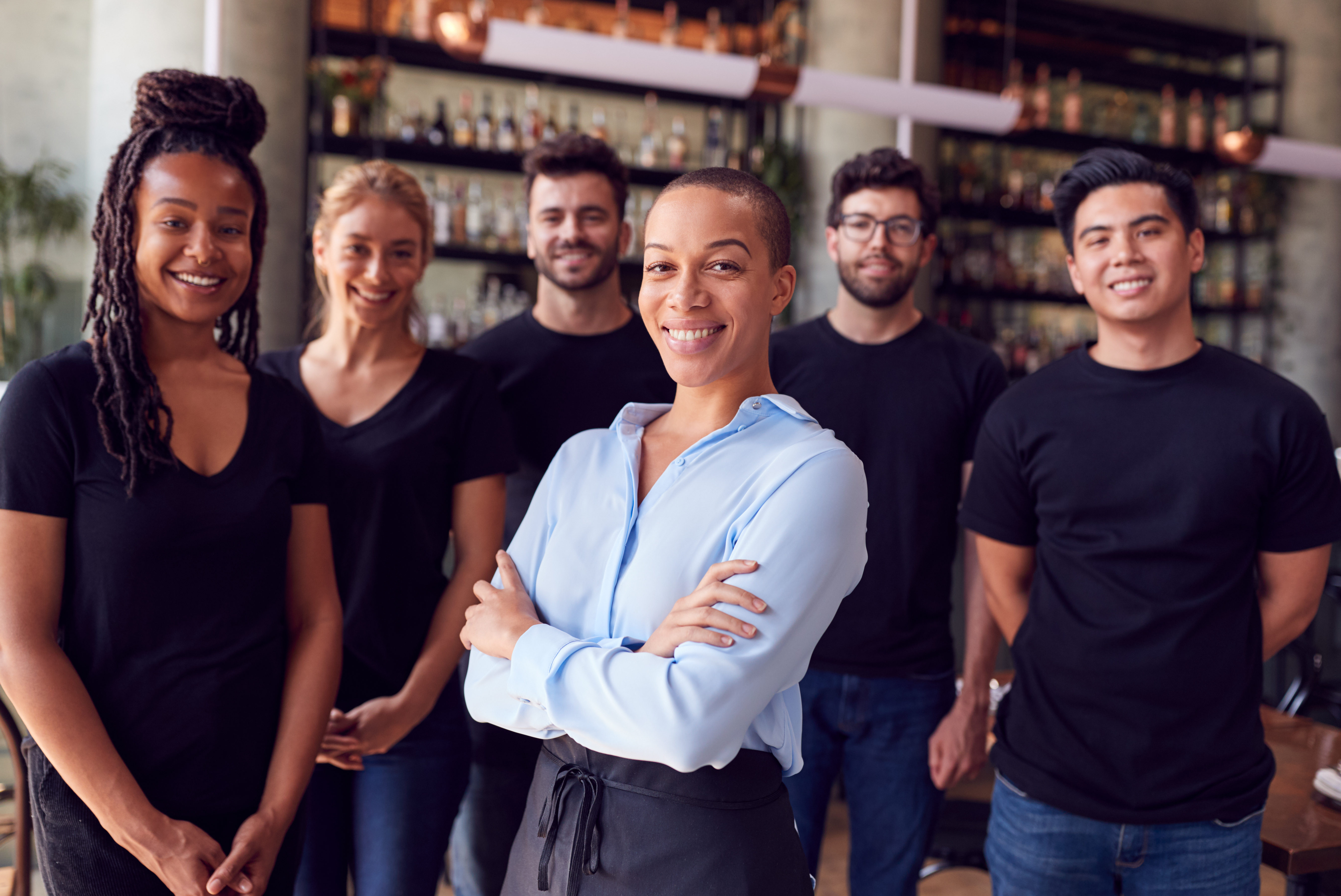 A Restaurant Team Using Labor Management Software To Comply With New Labor Laws