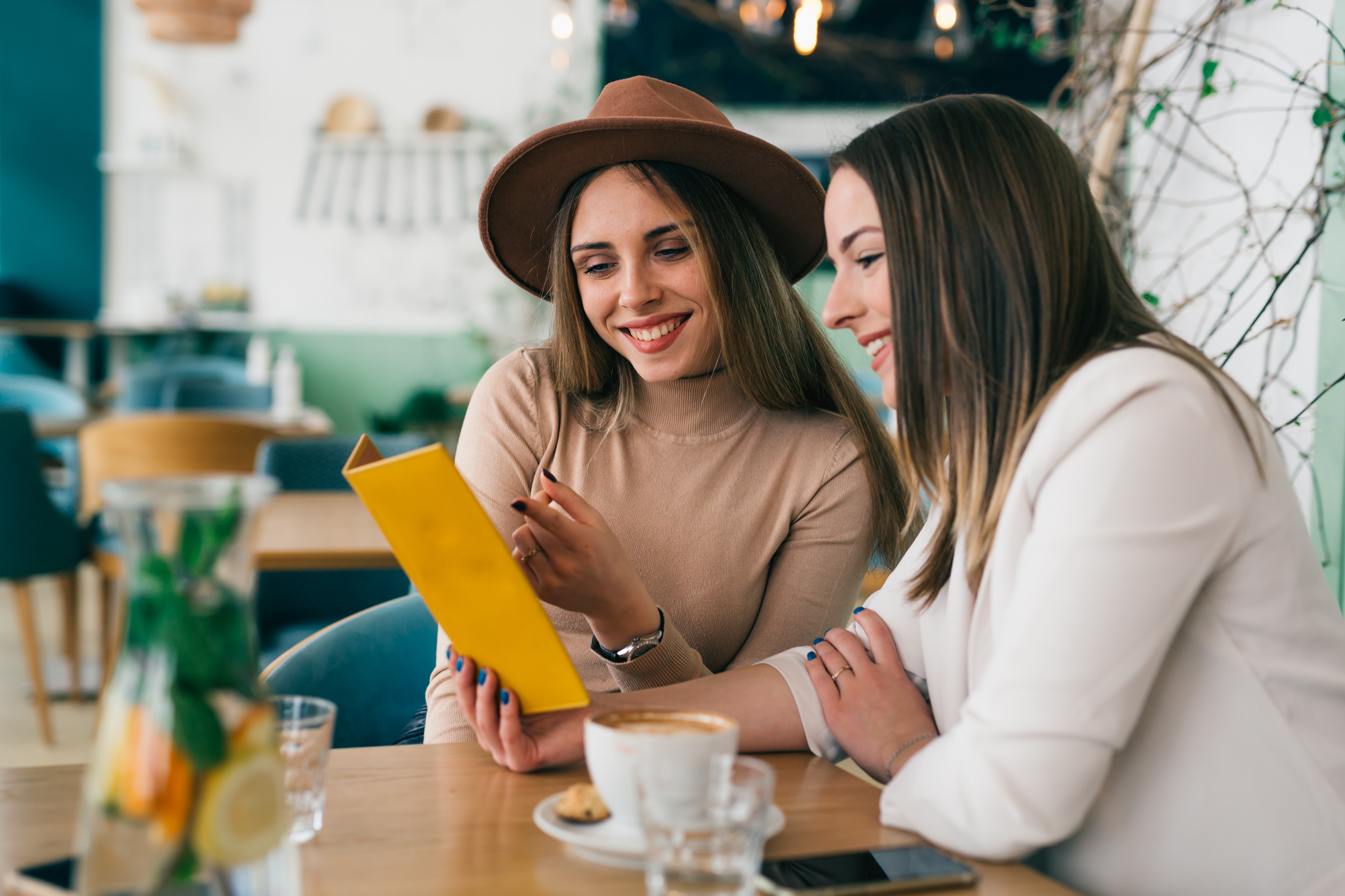 Happy Restaurant Customers Reading Menu