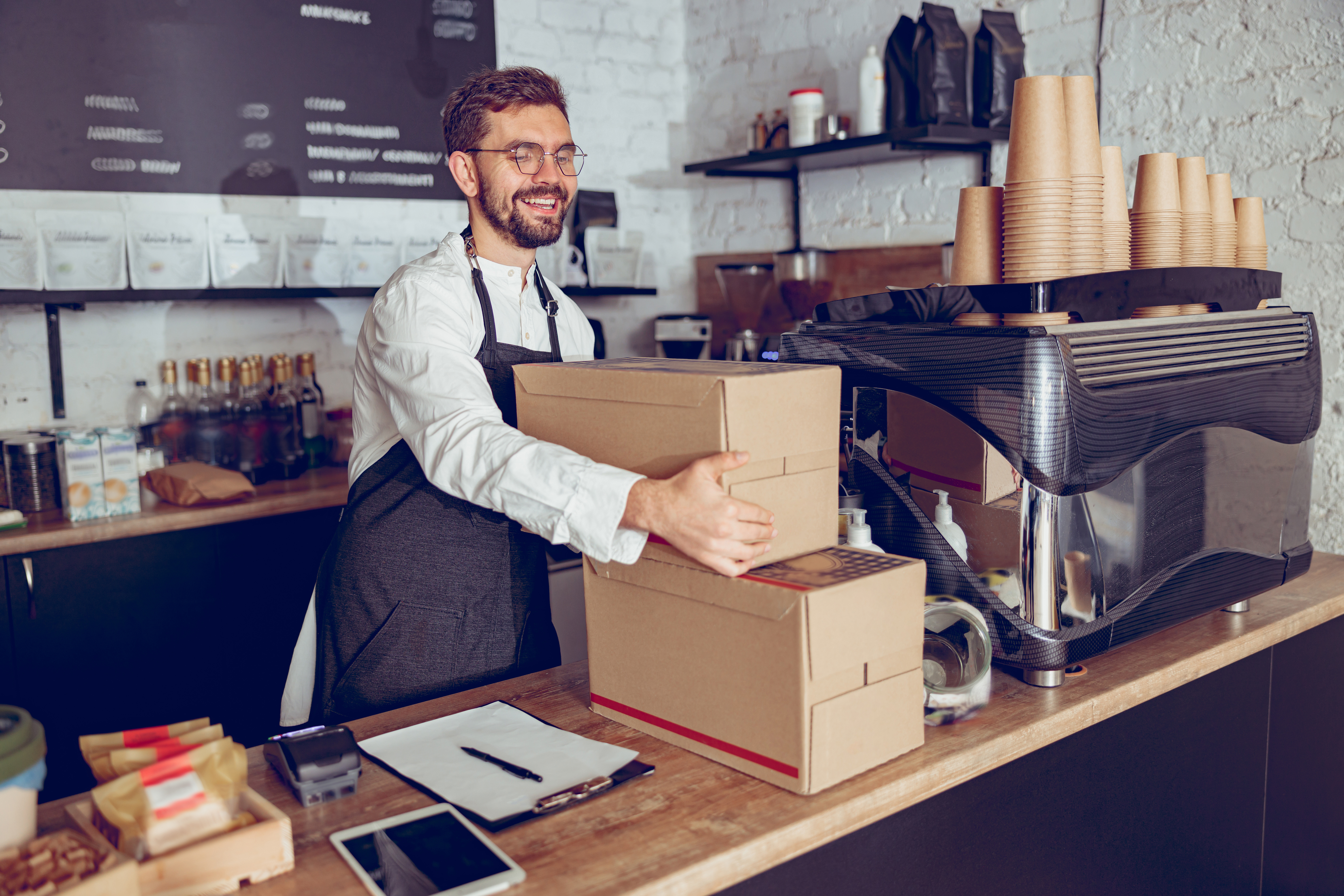 Restaurant Worker Checking Inventory with Inventory Management Software