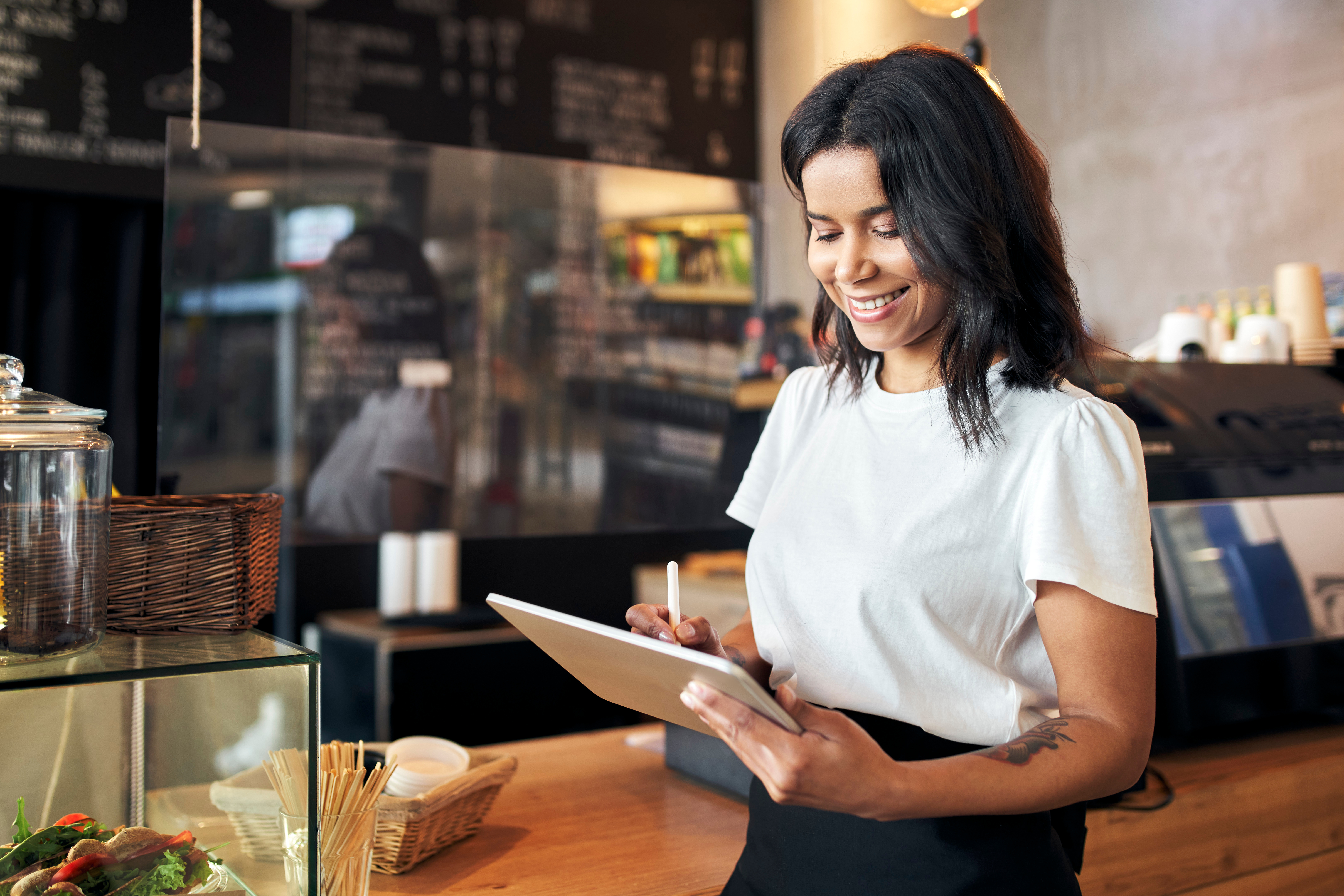 Waitress Using Restaurant Inventory Management Mobile Software