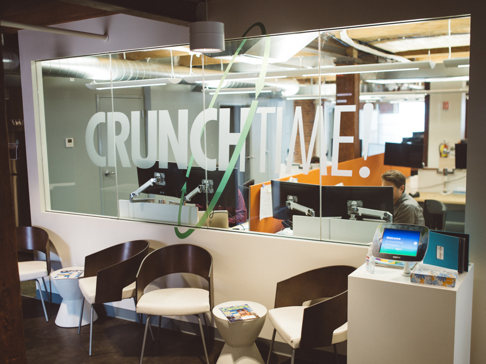 CrunchTime logo on glass wall in the CrunchTime offices