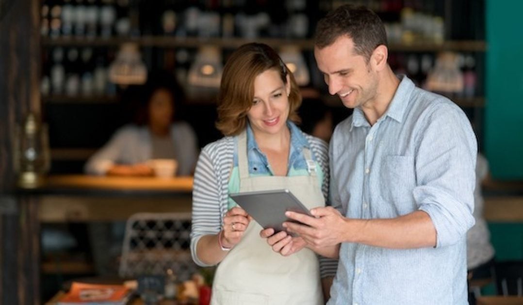 Restaurant managers using restaurant software