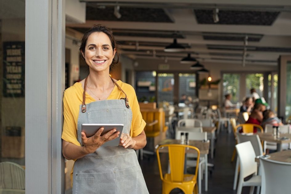Restaurant Worker Using Restaurant Management Mobile Software