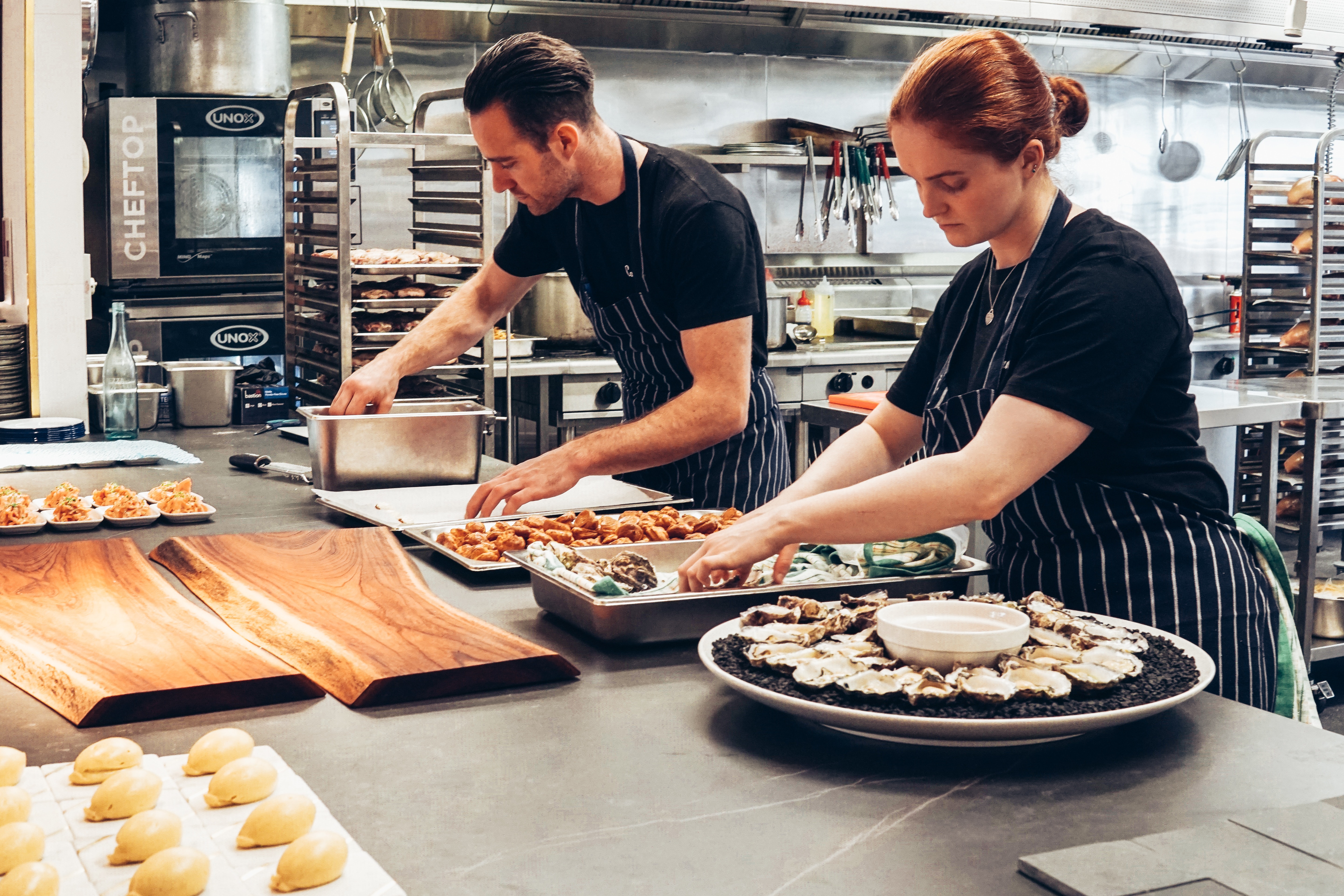 Restaurant cooks preparing food