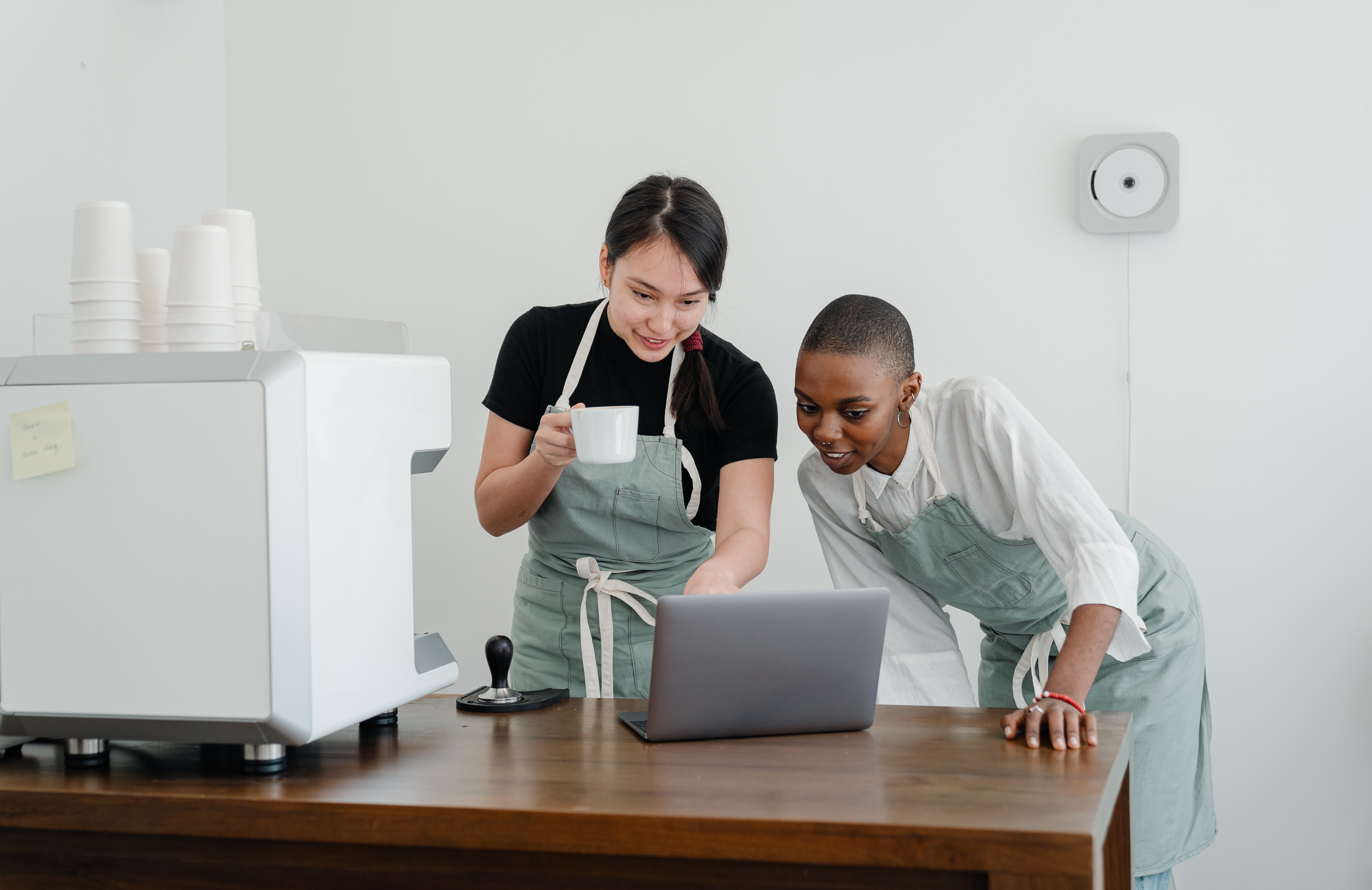 Two Restaurant Workers Using Restaurant Management Software